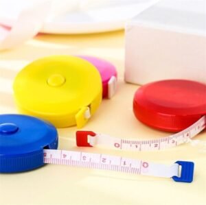 Retractable tape measure Australia Random color, front view, showing 5cm diameter.