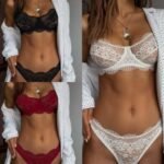 Woman in lace erotic lingerie set Pink color, front view, showing sheer design.