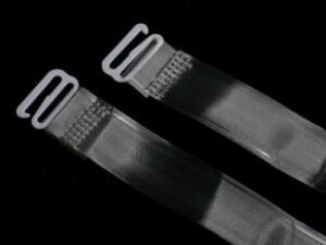 Woman using clear bra straps Australia Transparent color, front view, showing metal buckle.