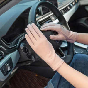 Woman in UV protection driving gloves Pink color, front view, showing cotton mesh design.