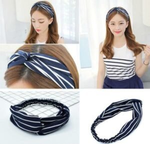 Woman using elastic yoga headband women Black color, front view, showing cross design.