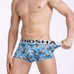 Man in U pouch boxer shorts men Blue color, front view, showing stripe design.