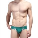 Man in mesh penis pouch briefs Blue color, front view, showing pouch design.