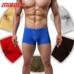 Man in ice silk seamless boxers Black color, front view, showing seamless design.