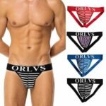 Man in mens bulge pouch underwear Red color, front view, showing striped design.