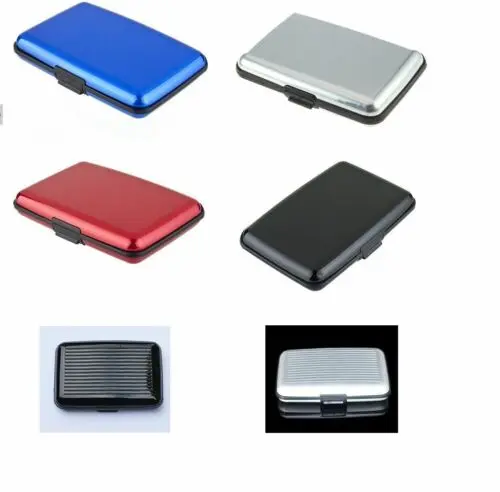 12-954.jpg Person with waterproof ID wallet Australia Black color, front view, showing aluminum case.
