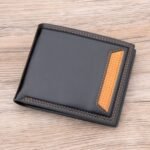 Man with men’s PU leather wallet Australia Dark coffee color, front view, showing bifold design.