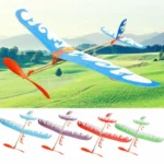 Kid with rubber band plane toy Australia Multicolor design, front view, showing wooden build.
