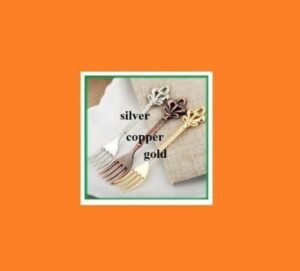 Person with retro fruit fork Australia Silver color, front view, showing elegant design.