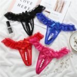 Woman in sexy pearl thongs Pink color, front view, showing pearl beads.