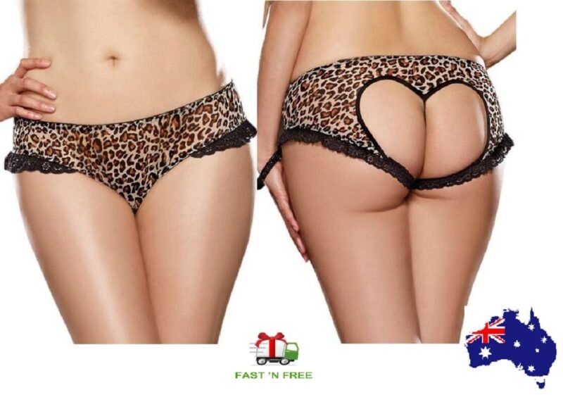 Woman in plus size leopard panties XL color, front view, showing lace trim.