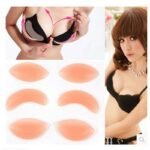 Woman in silicone bra inserts Black color, front view, showing natural lift.