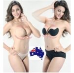 Woman in self adhesive bra pads Black color, front view, showing push up lift.