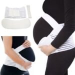 Pregnant woman in maternity support belt White color, front view, showing adjustable fit.