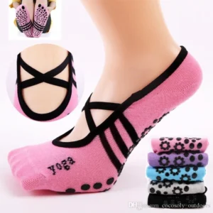 Woman in anti slip yoga socks, front view, showing grip dot design.