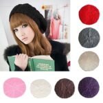 Woman in slouch knitted beret hat Red color, front view, showing braided design.