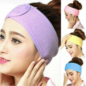Woman using spa makeup headband Multicolored, front view, showing elastic design.