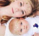 Woman and baby in mummy baby leaf headband Gold color, front view, showing leaf design.