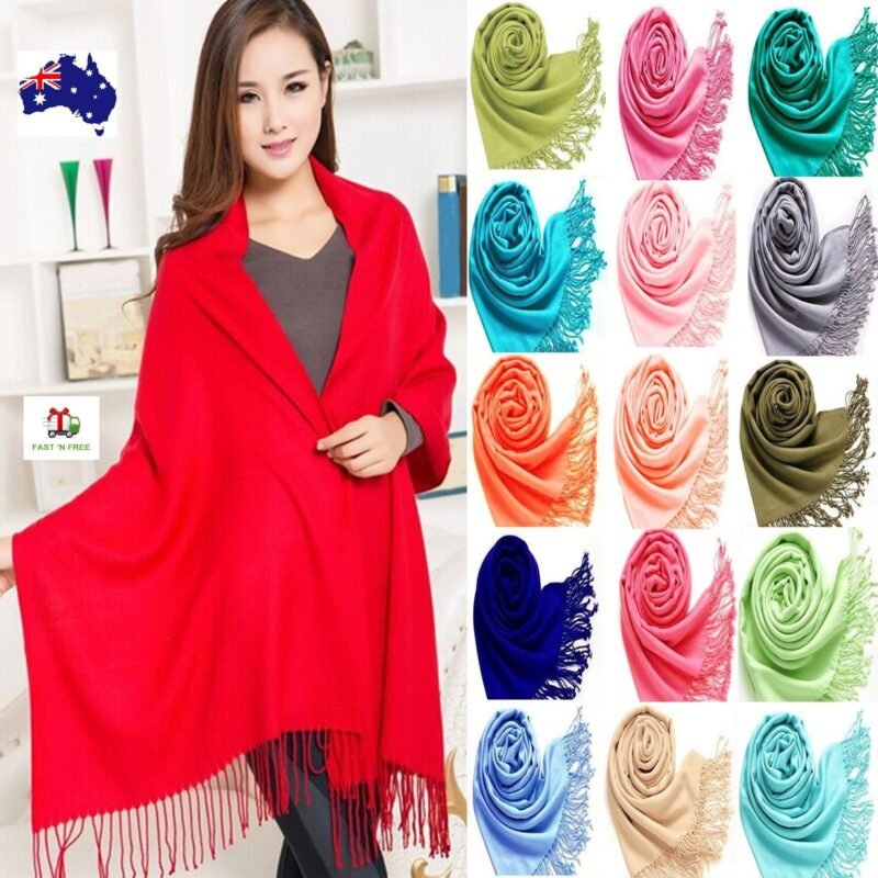 Woman in pashmina winter scarf women Neutral color, front view, showing solid design.