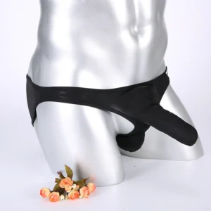 Man in sexy low waist briefs men Black color, front view, showing pouch design.