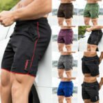 Man in dry fit gym shorts men Black color, front view, showing nylon design.