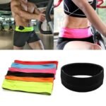 Person in expandable running belt Australia Black color, front view, showing tubular pocket.