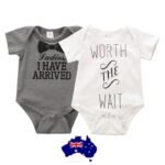 Baby with cotton baby romper Australia White color, front view, showing letter print.