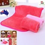 Person with reusable makeup remover towel Australia Shown color, front view, showing microfibre design.