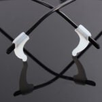 Person with silicone glasses strap Australia White color, front view, showing grip design.