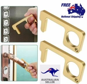 Person with no touch door opener Australia Gold/Silver color, front view, showing keychain design.