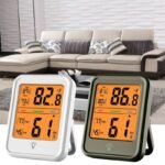 Person with hygrometer thermometer Australia White color, front view, showing LCD display.