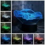 Person with Ferrari night light Australia Clear acrylic color, front view, showing 3D car.