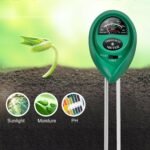 Person with soil tester Australia Green color, front view, showing probe.