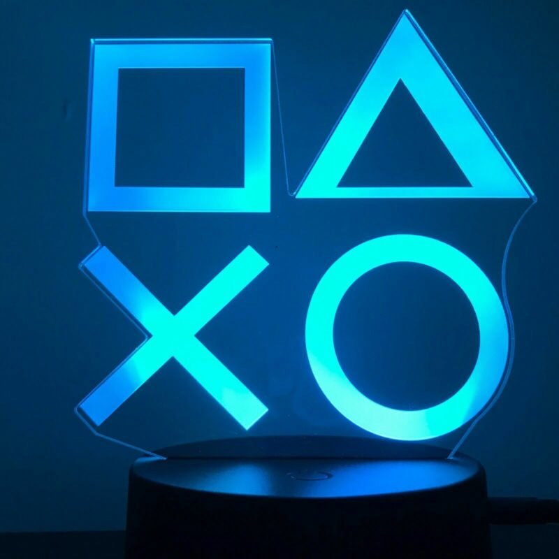 Person with PS night light Australia Clear acrylic color, front view, showing 3D PS logo.