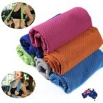 Person with cooling towel Australia Light blue color, front view, showing folded design.