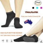 Person with yoga socks Australia Black color, front view, showing grip dots.