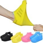 Person with waterproof shoe covers Australia Black color, front view, showing silicone design.