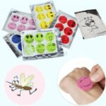 Person with mosquito repellent stickers Australia Smiling face color, front view, showing patch design.