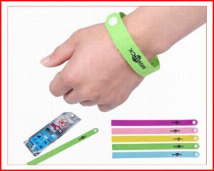 Person with mosquito repellent bracelets Australia Random color, front view, showing wrist fit.