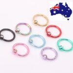 Person with nose piercing jewelry Australia Gold color, front view, showing crystal stud.