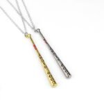 Person with Harley Quinn necklace Australia Gold color, front view, showing baseball bat pendant.