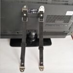 Anti-tip straps Australia White/black zinc, front view, showing metal buckle.