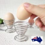Boiled egg holder Australia Silver stainless steel stand, front view, showing spring design.