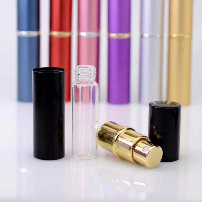- Person using travel refillable atomizer Black color front view showing mini design