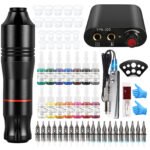 Complete tattoo kit with rotary machine, inks, needles and power supply displayed on clean surface