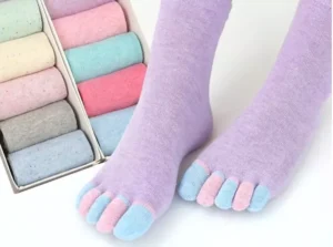 Woman in breathable non slip socks, front view, showing five finger design.