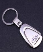 Titanium Subaru car emblem keyring with ring logo on a white background.