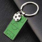 Green metal basketball field keychain for women with a double-sided logo.