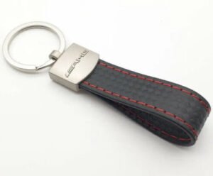 Black leather AMG Mercedes keyring with carbon effect and logo.