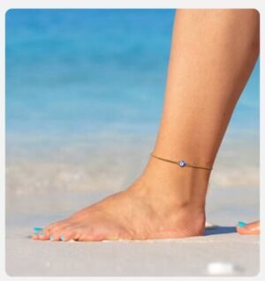 Multi-layered blue evil eye anklet on a woman’s ankle in Australia.